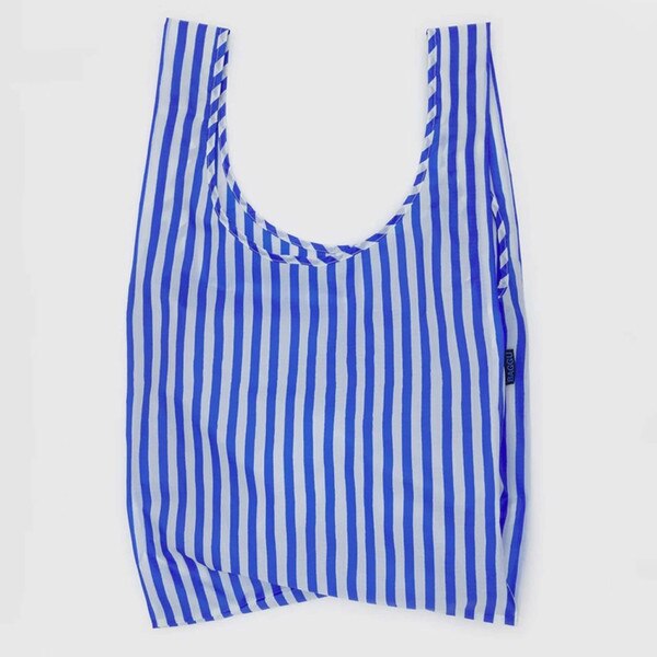 Blue and white vertically striped reusable BAGGU bag with blue logo tag,